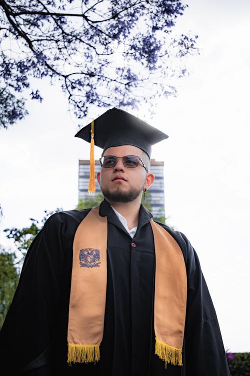 Graduate Posing in Academic Hat and Gown