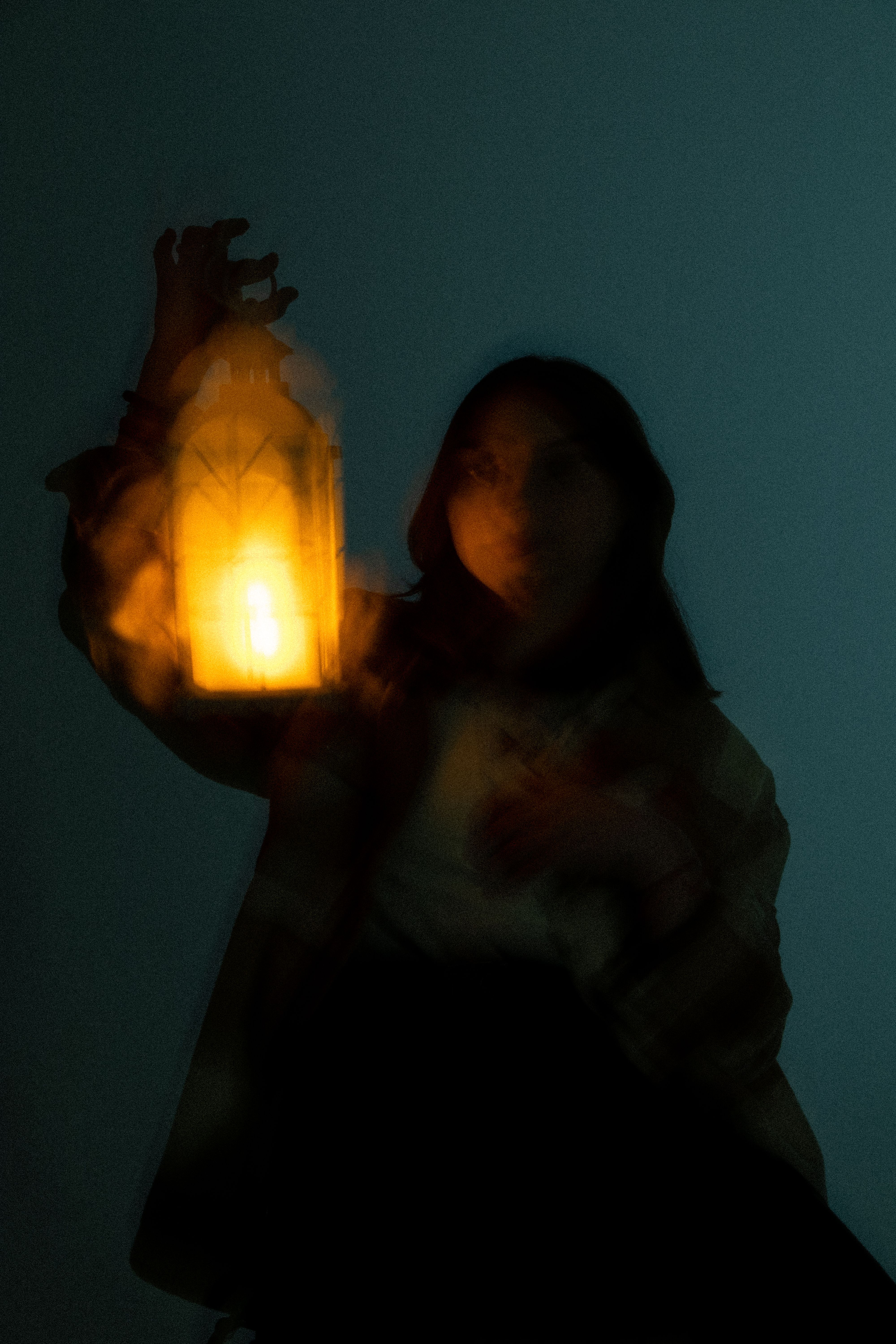 Silhouette of Woman Holding Lantern in Night · Free Stock Photo