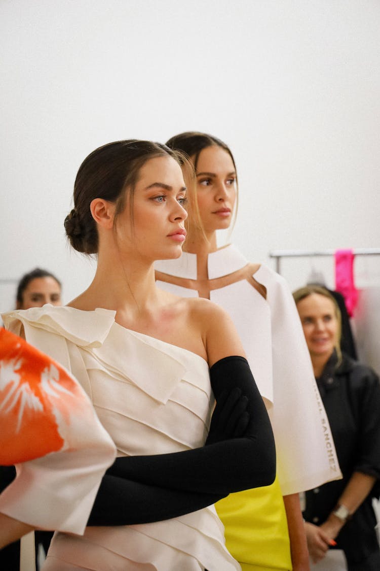 Two Models Wearing Dresses 