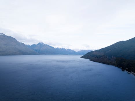 Stunning aerial view of Lake Wakatipu and surrounding mountains in Queenstown, New Zealand.