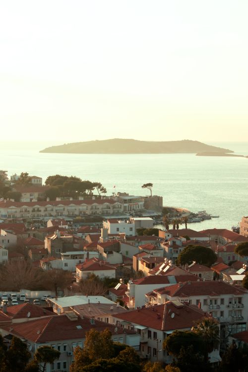 Free A picturesque aerial view of İzmir with seaside townscape during sunset reflecting serene beauty. Stock Photo