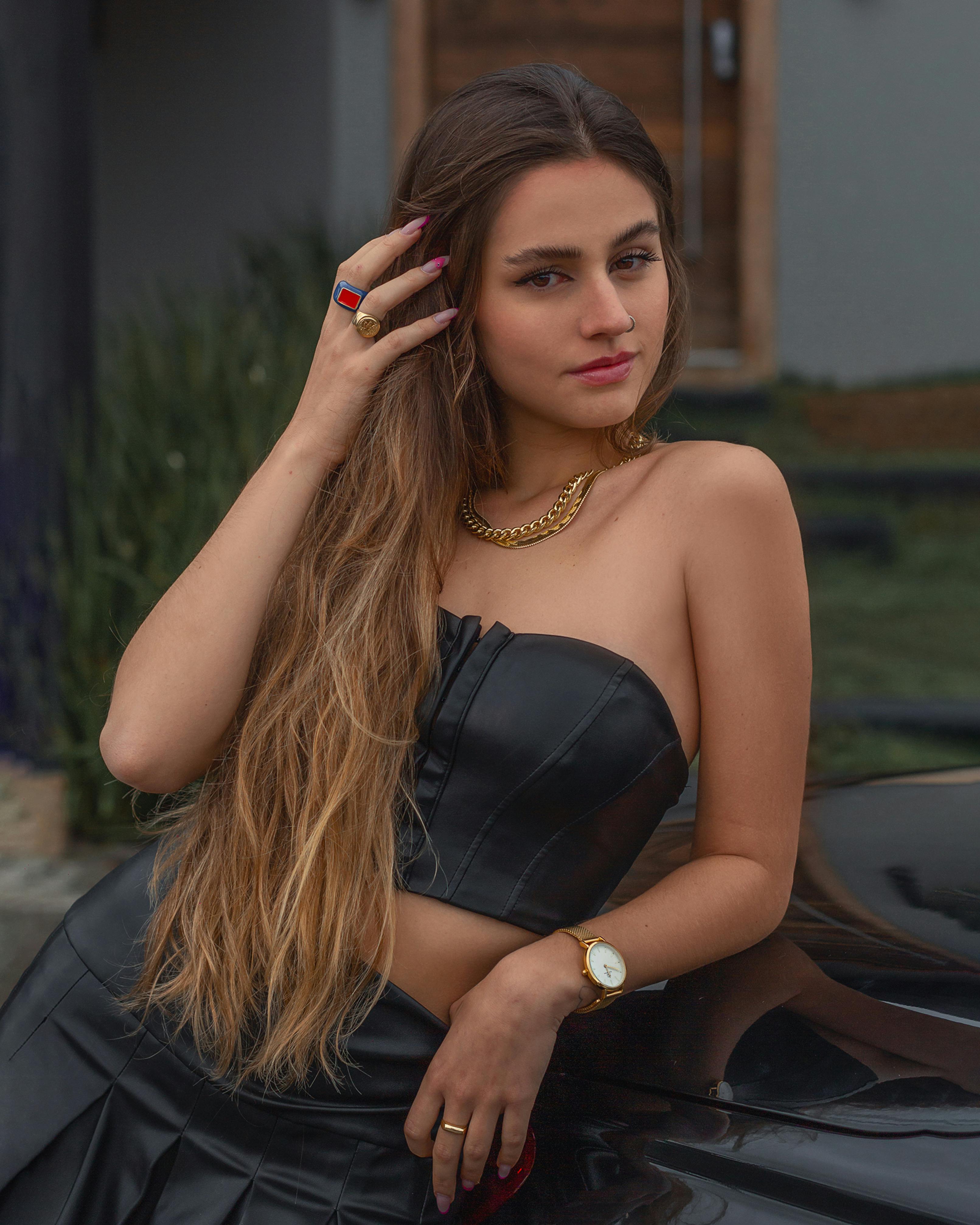 a-young-model-in-a-black-corset-and-a-black-mini-dress-free-stock-photo