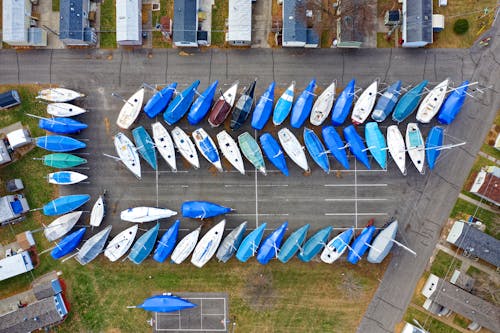 Parked Blue and White Kayaks