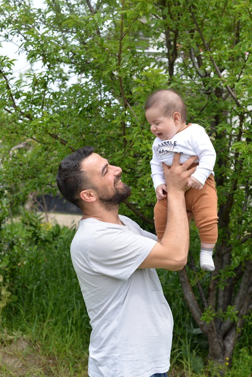 Free Man Smiling at Son Stock Photo