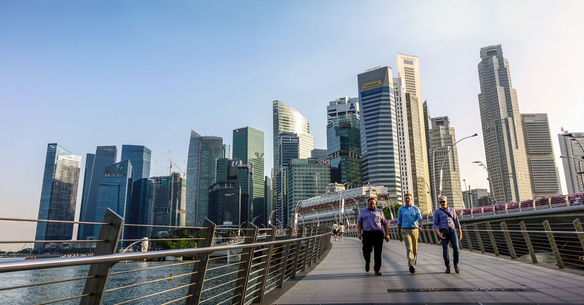 professional walking through singapore business district