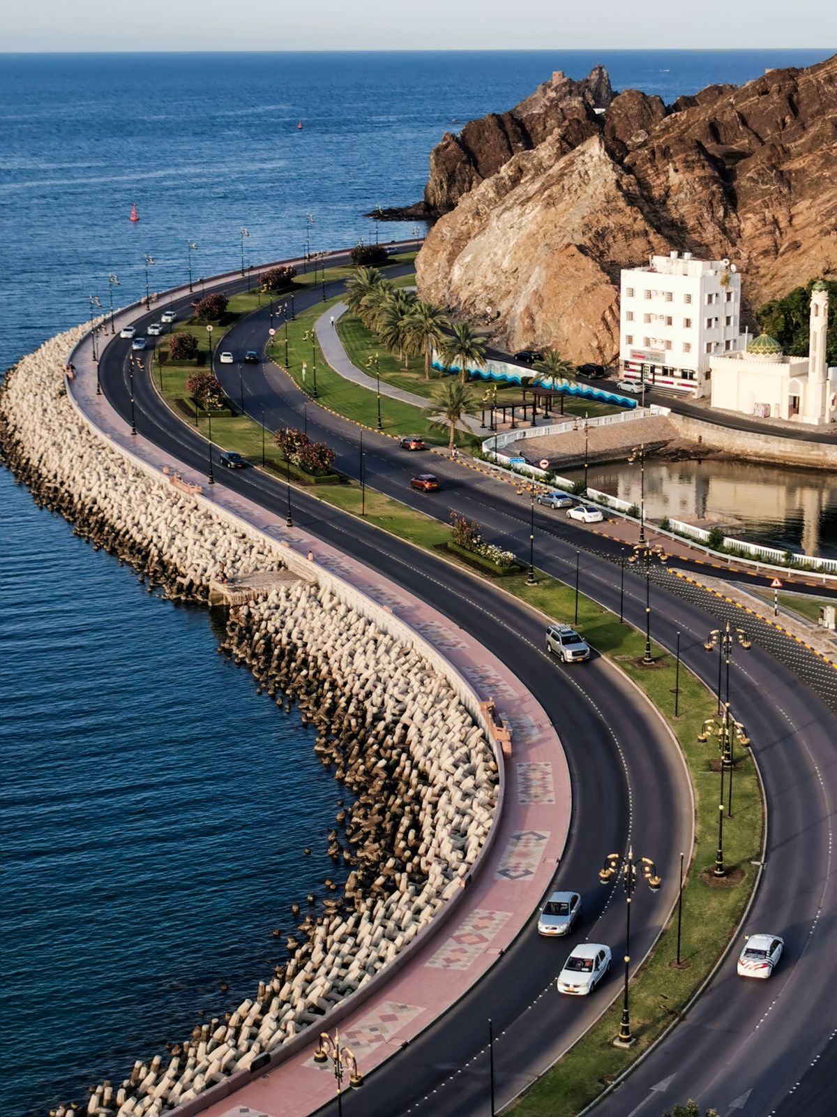 Aerial view of the Mutrah Corniche seafront road and fort in Muscat