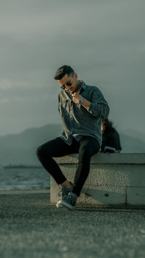 Model Posing in Shirt and Sunglasses