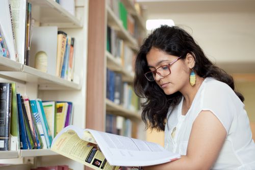 Confident young Indian student supported by an education loan