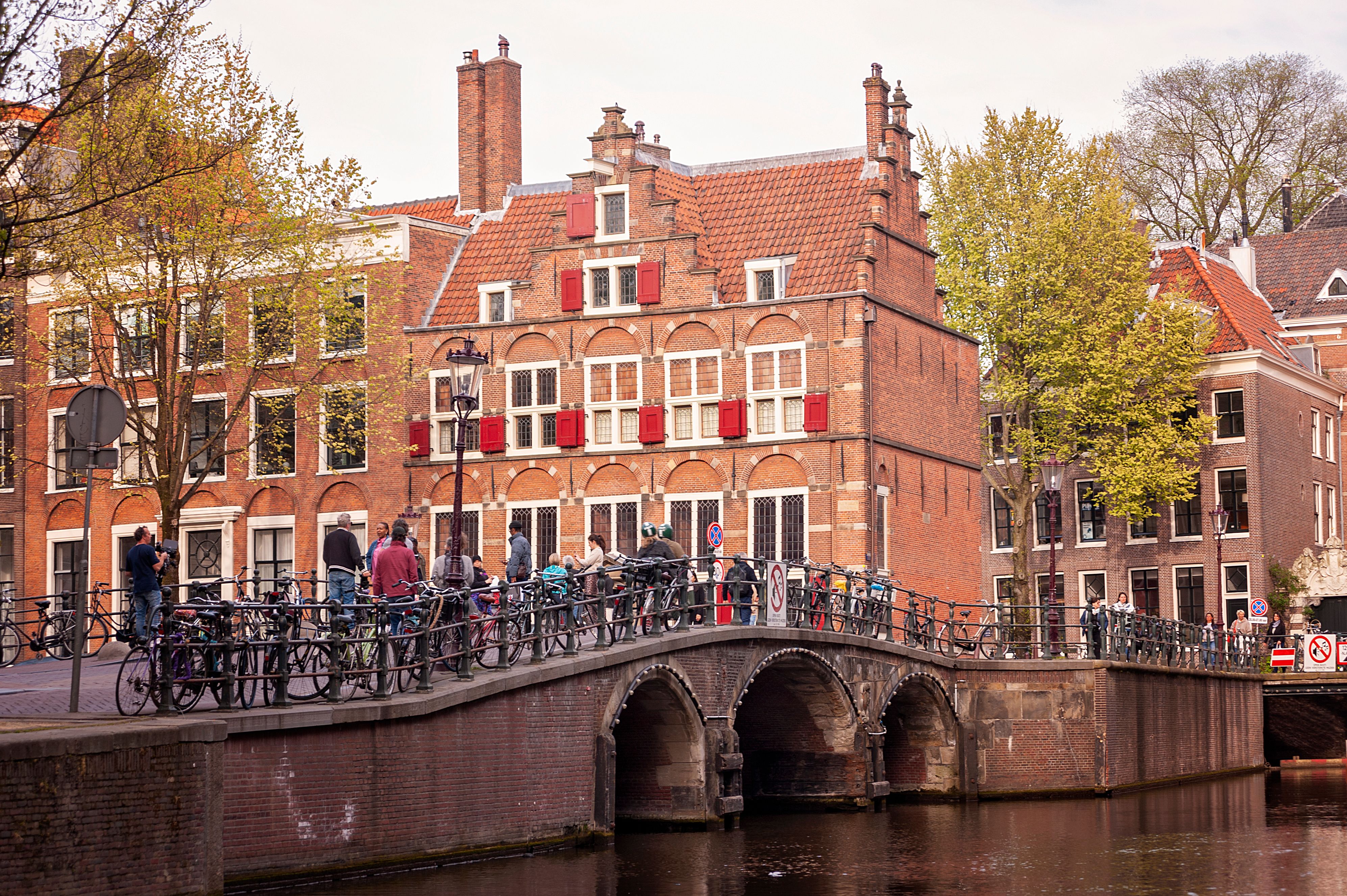 Crowds on a bridge over the Oudegracht during a busy Utrecht festival weekend