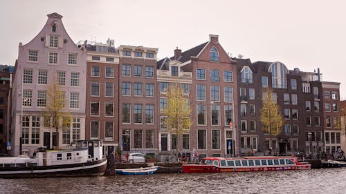 Residential Buildings and Passenger Boats in Amsterdam