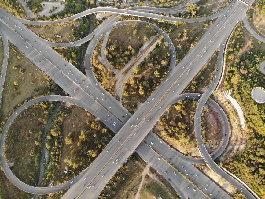 Stunning aerial view of a highway interchange in Islamabad, showcasing modern urban infrastructure and greenery.