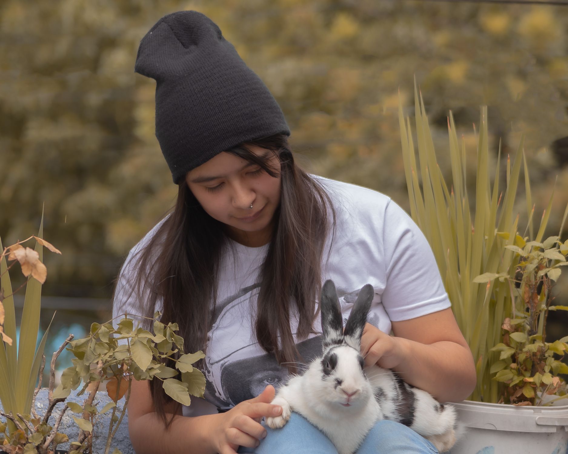 Teenage Girl Petting a Rabbit on her Lap · Free Stock Photo
