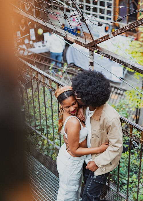 Young Couple Standing Face to Face and Embracing 