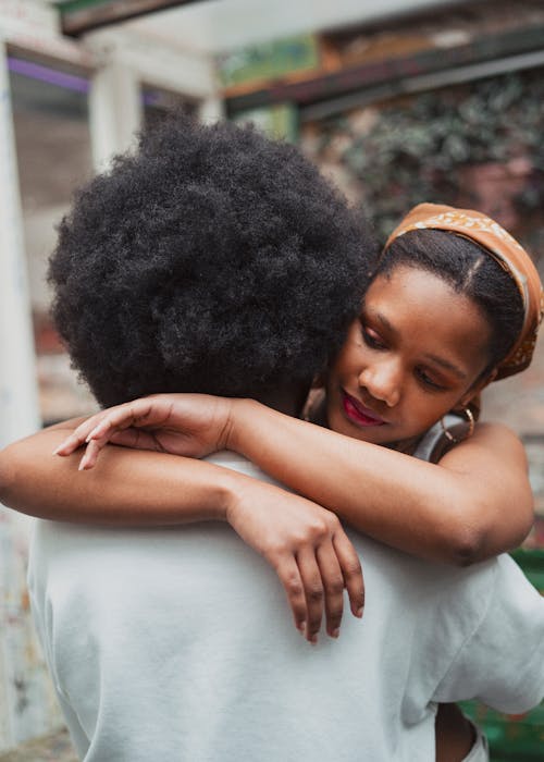 African Couple Hugging on a Street 