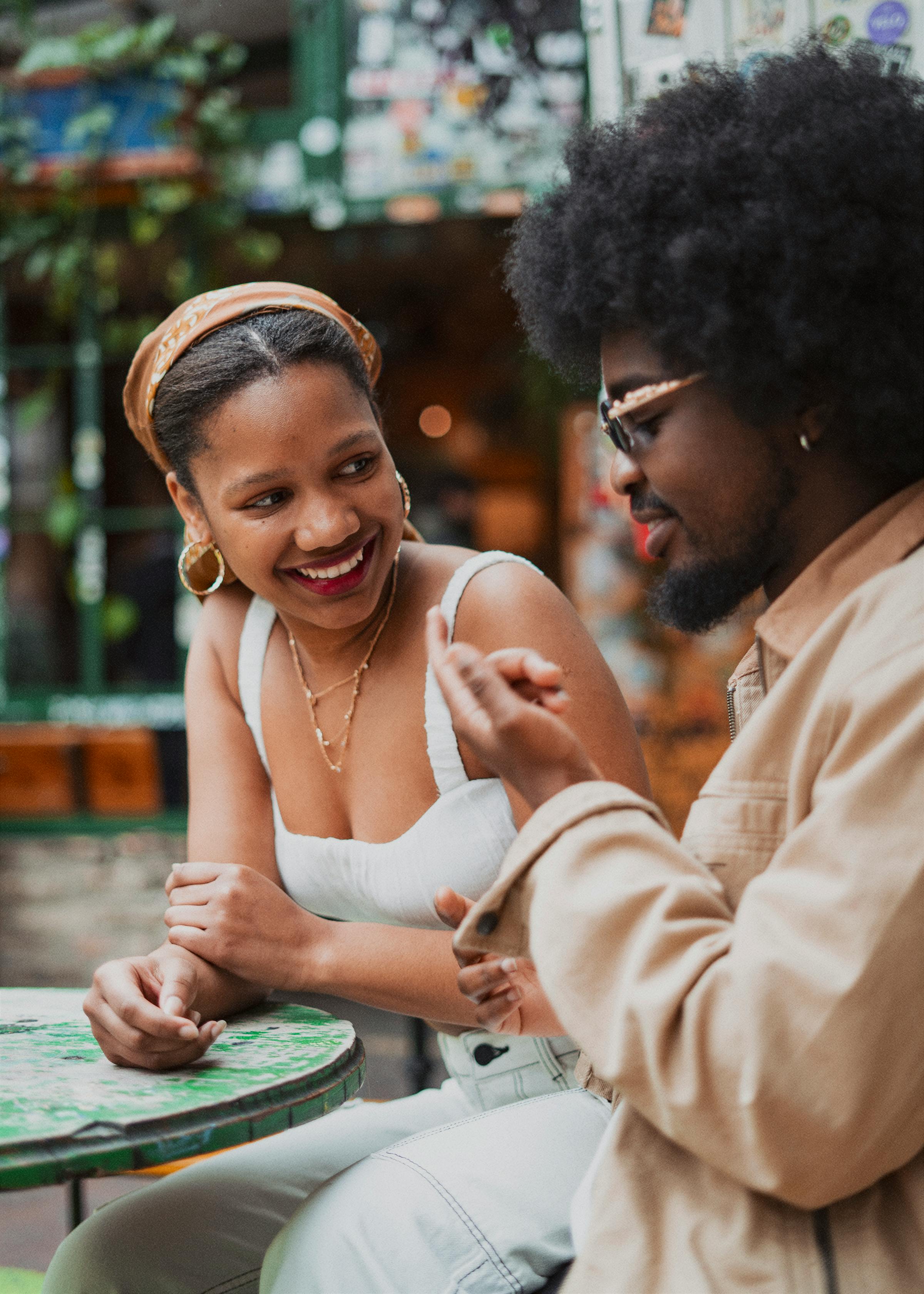 young couple sitting at a table together