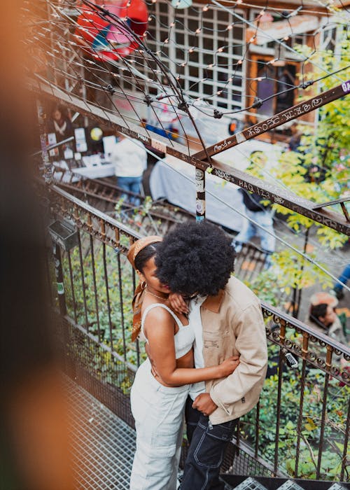 Young Couple Standing Face to Face and Embracing 