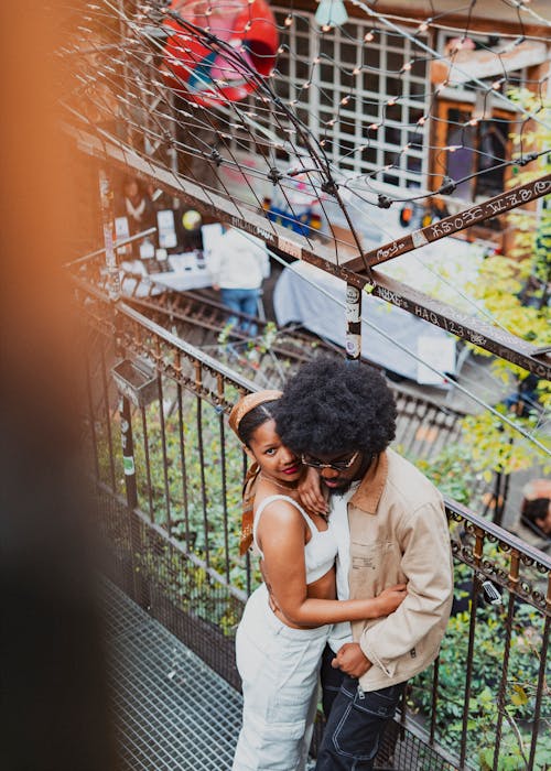 High Angle View of a Young Couple Standing Face to Face and Embracing 