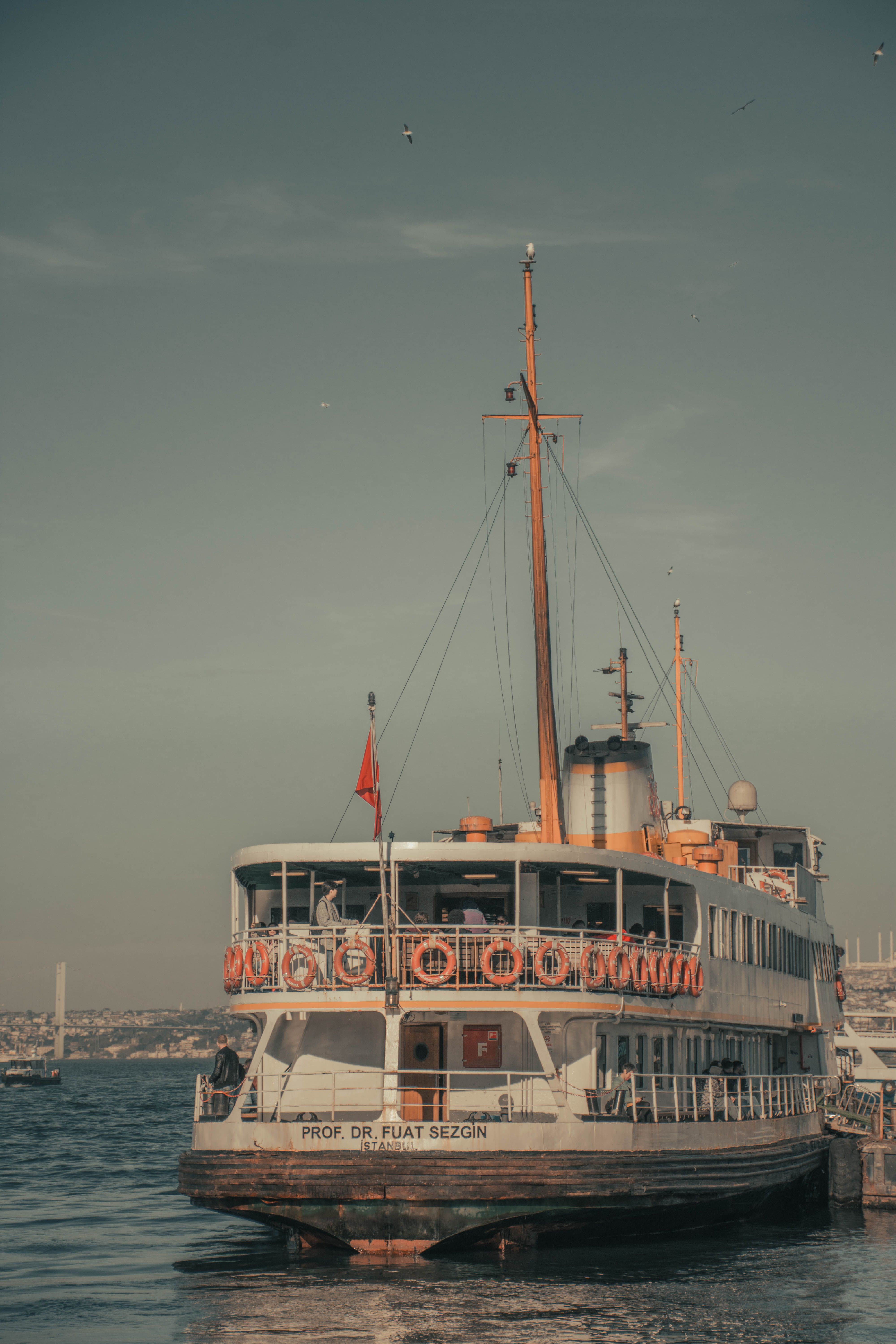 A vintage ferry named Prof. Dr. Fuat Sezgin docked at a harbor in Istanbul, Turkey.