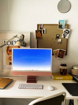 Stylish home office setup with modern computer and decor for remote work.