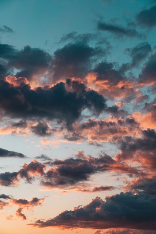 Free Stunning sunset clouds create a colorful evening sky over Genève, Switzerland. Stock Photo