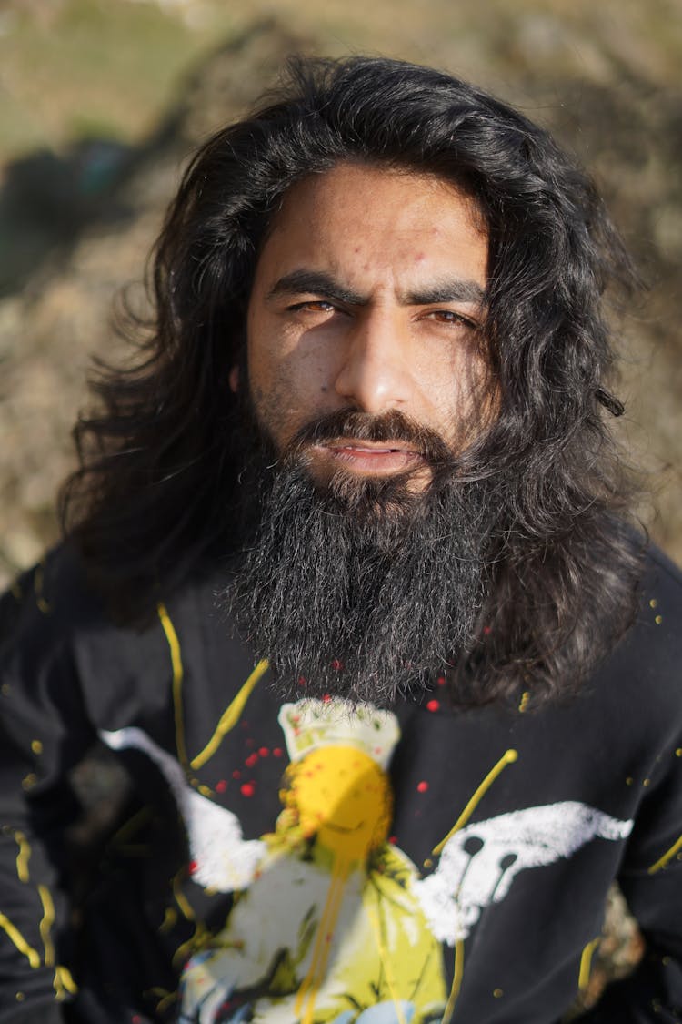 Man With Thick Black Beard Wearing Graphic T-Shirt