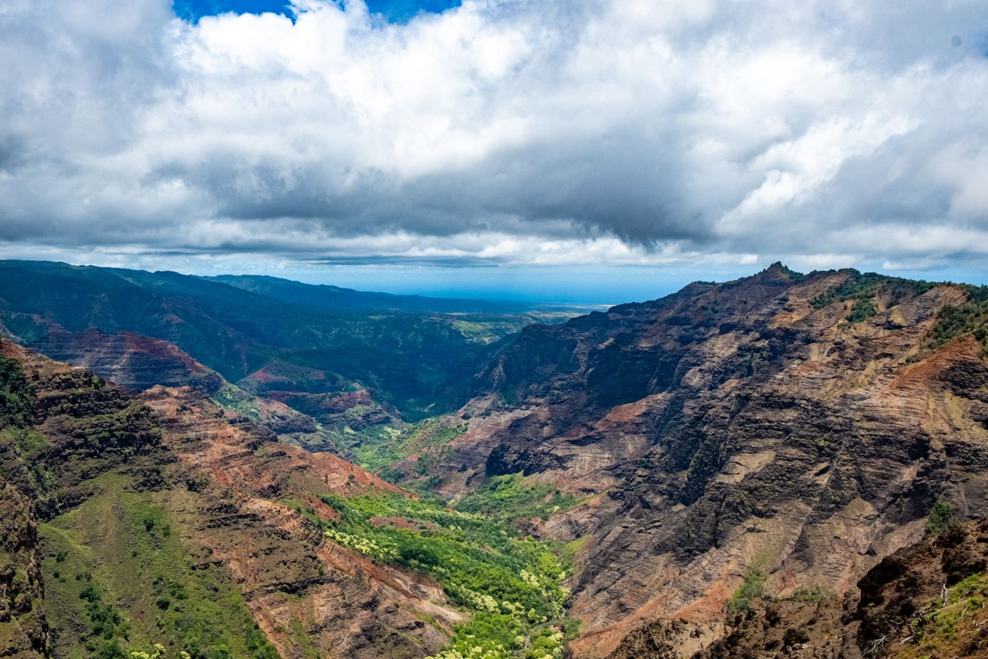 An open road climbing towards Waimea Canyon on Kauaʻi