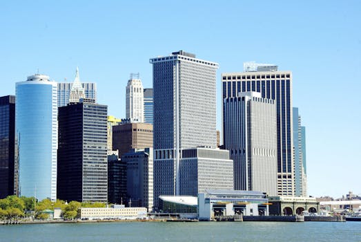 View of New York City's iconic waterfront skyline with modern skyscrapers.