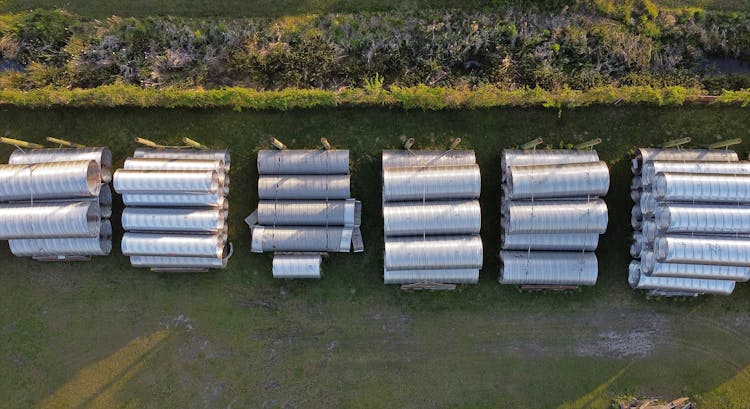 Aerial View Of Stacks Of Large Aluminum Pipes