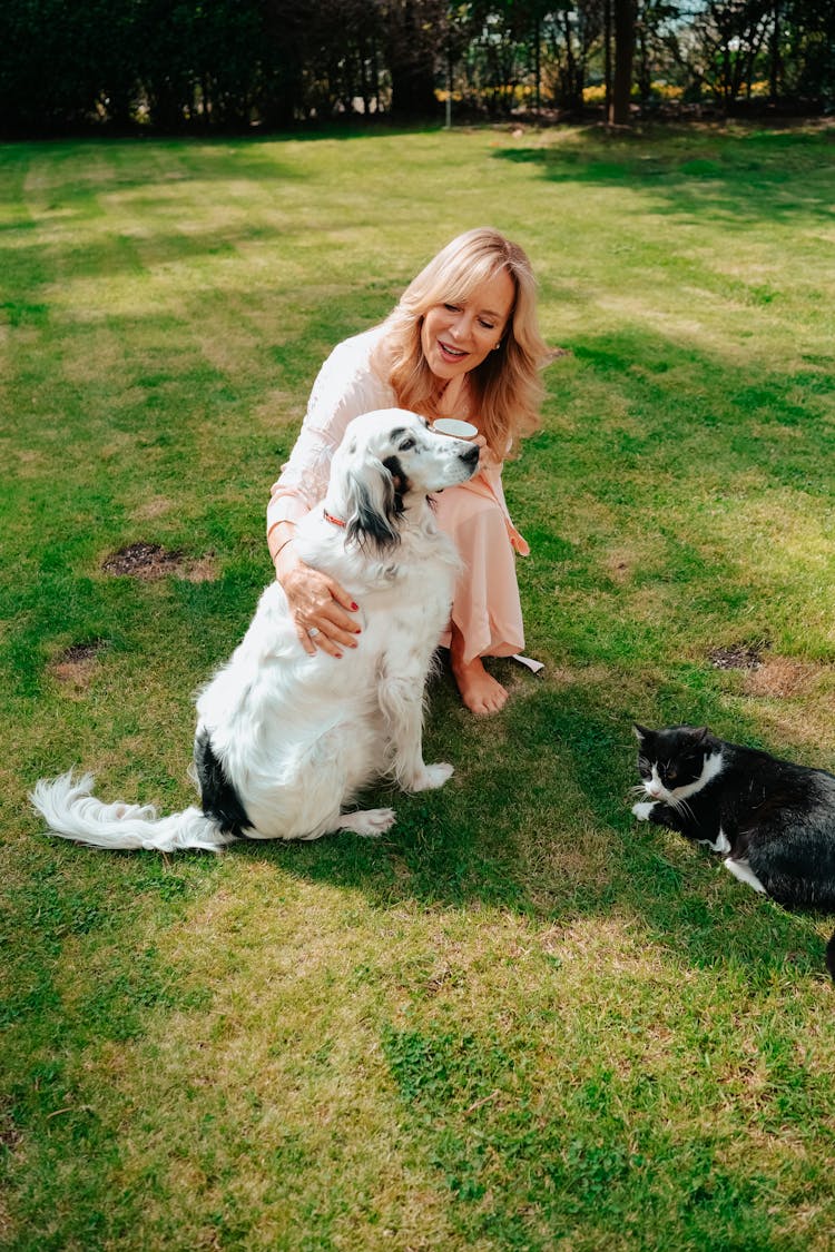 Smiling Woman With Dog And Cat