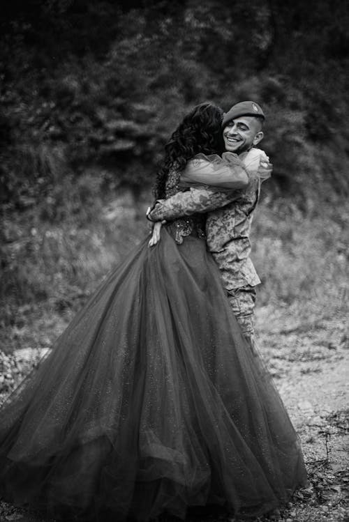 Soldier Embracing a Woman Wearing an Evening Gown
