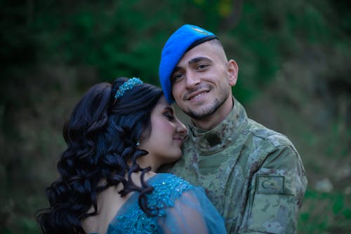 Soldier Embracing a Young Woman