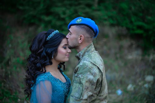 Soldier Kissing Woman in Dress