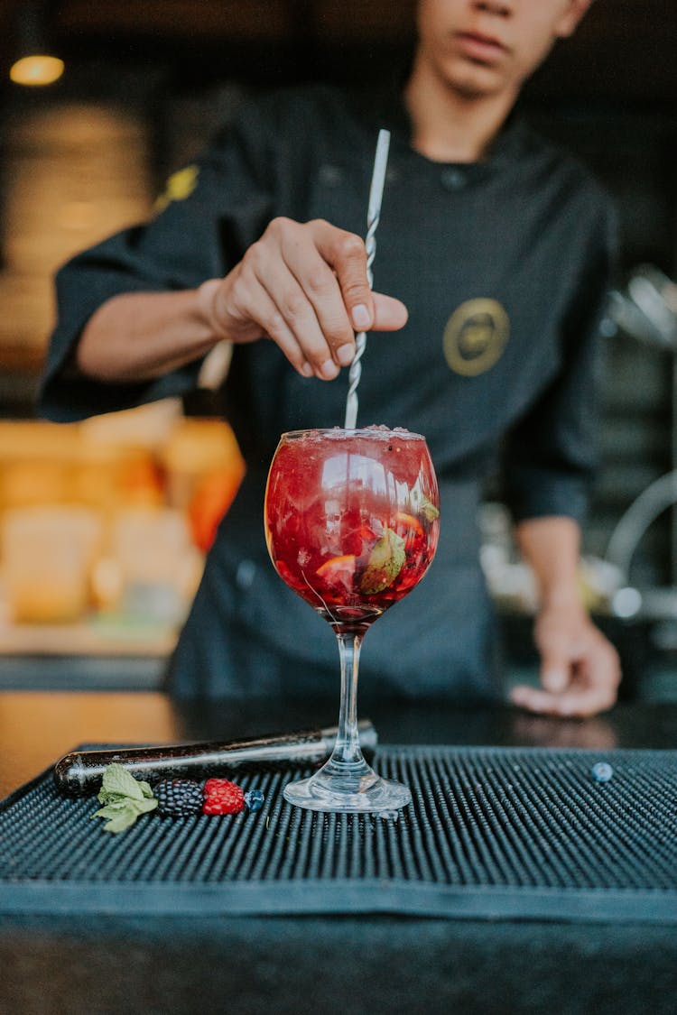 Man Preparing Red Cocktail 