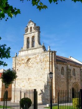 Capture of a historic chapel in Zamora, Spain, featuring bell towers and a clear blue sky.