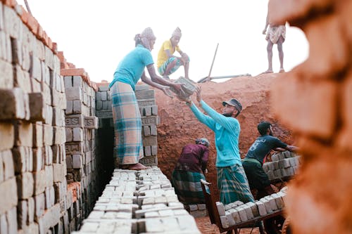 Photo of People Working in a Brickyard