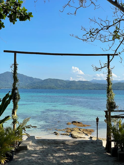 Mountains across the Tropical Bay seen from the Beach 