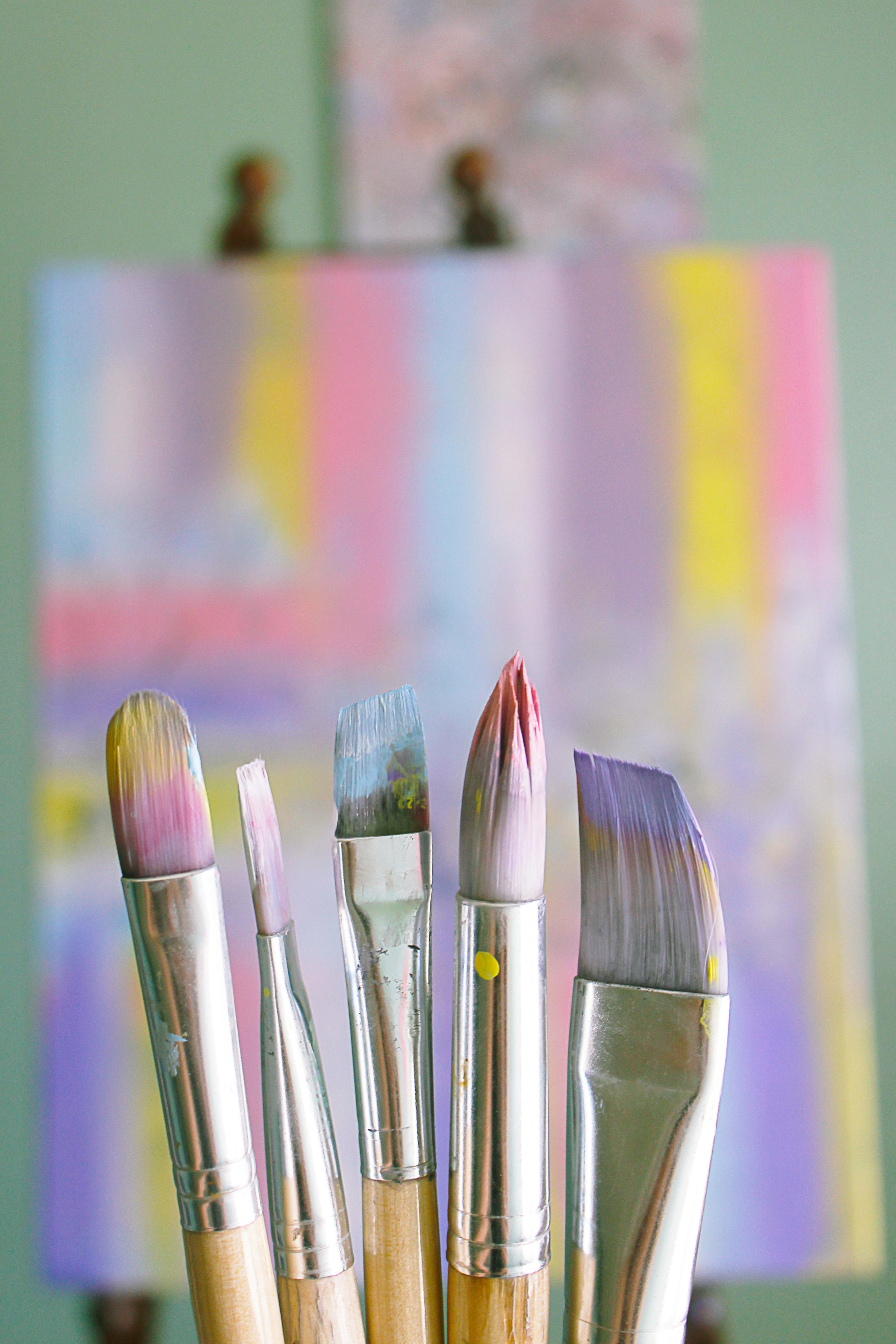 Assorted used paint brushes hi-res stock photography and images