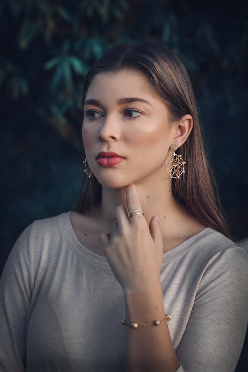 Portrait of Woman Wearing Gold Ea