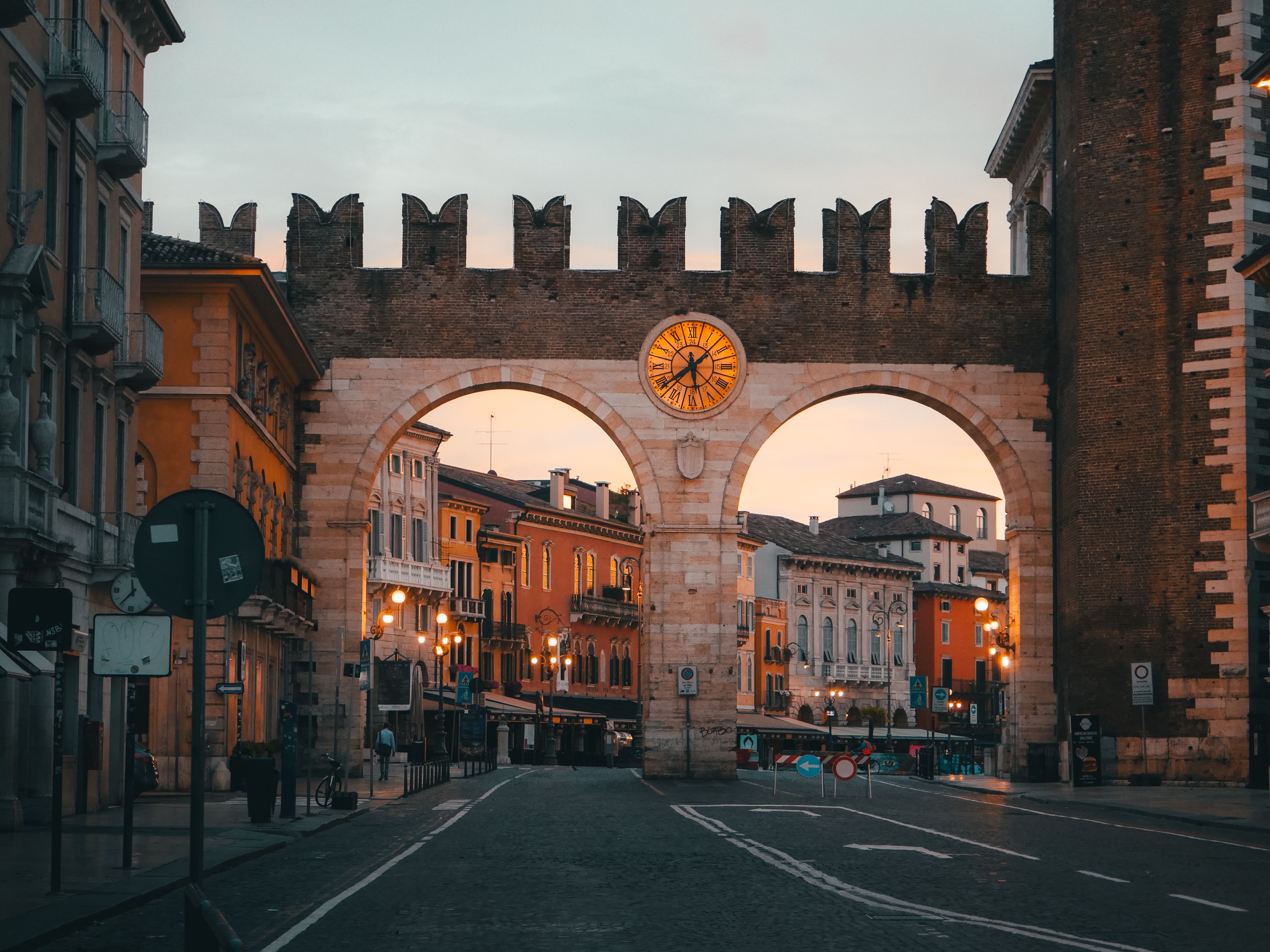 Historic Porta Nuova at sunset, showcasing Verona's vibrant colors and rich architectural heritage.