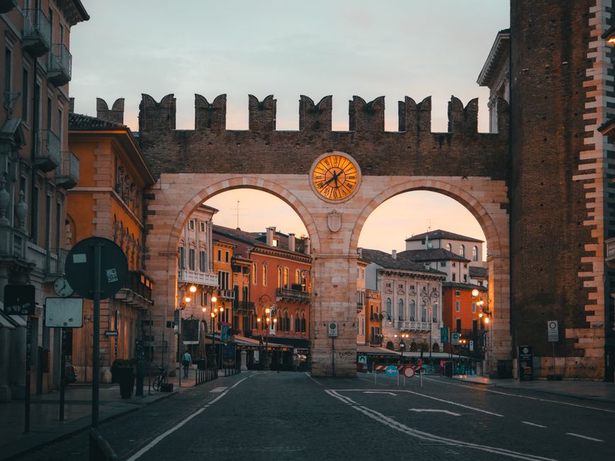 Historic Porta Nuova at sunset, showcasing Verona's vibrant colors and rich architectural heritage.