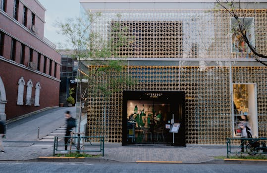 Explore a modern Tokyo bistro with a distinctive geometric facade, showcasing contemporary urban architecture.