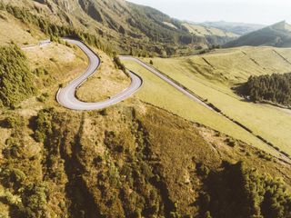 Switchback road through green hills — Humphrey Muleba on Pexels