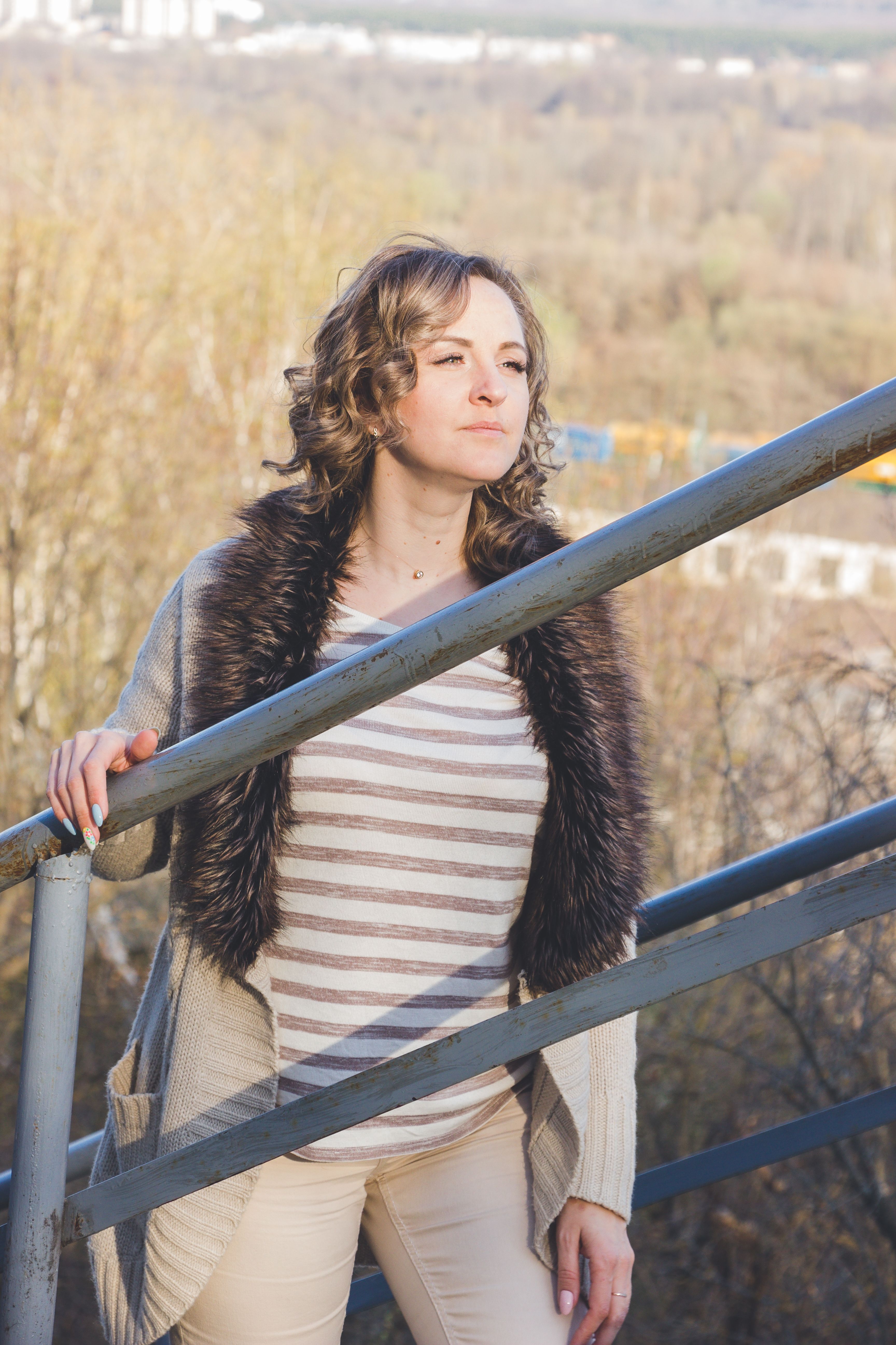 Woman Holding Handrail and Posing · Free Stock Photo