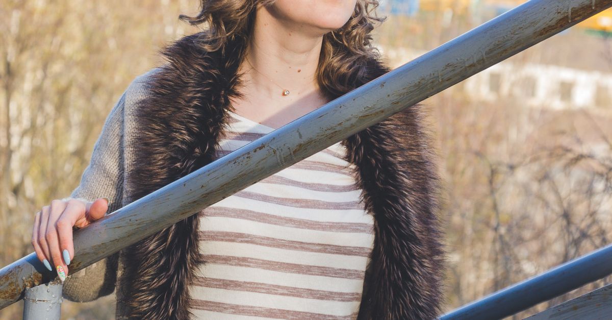 Woman Using Handrail Woman Holding Handrail and Posing · Free Stock Photo