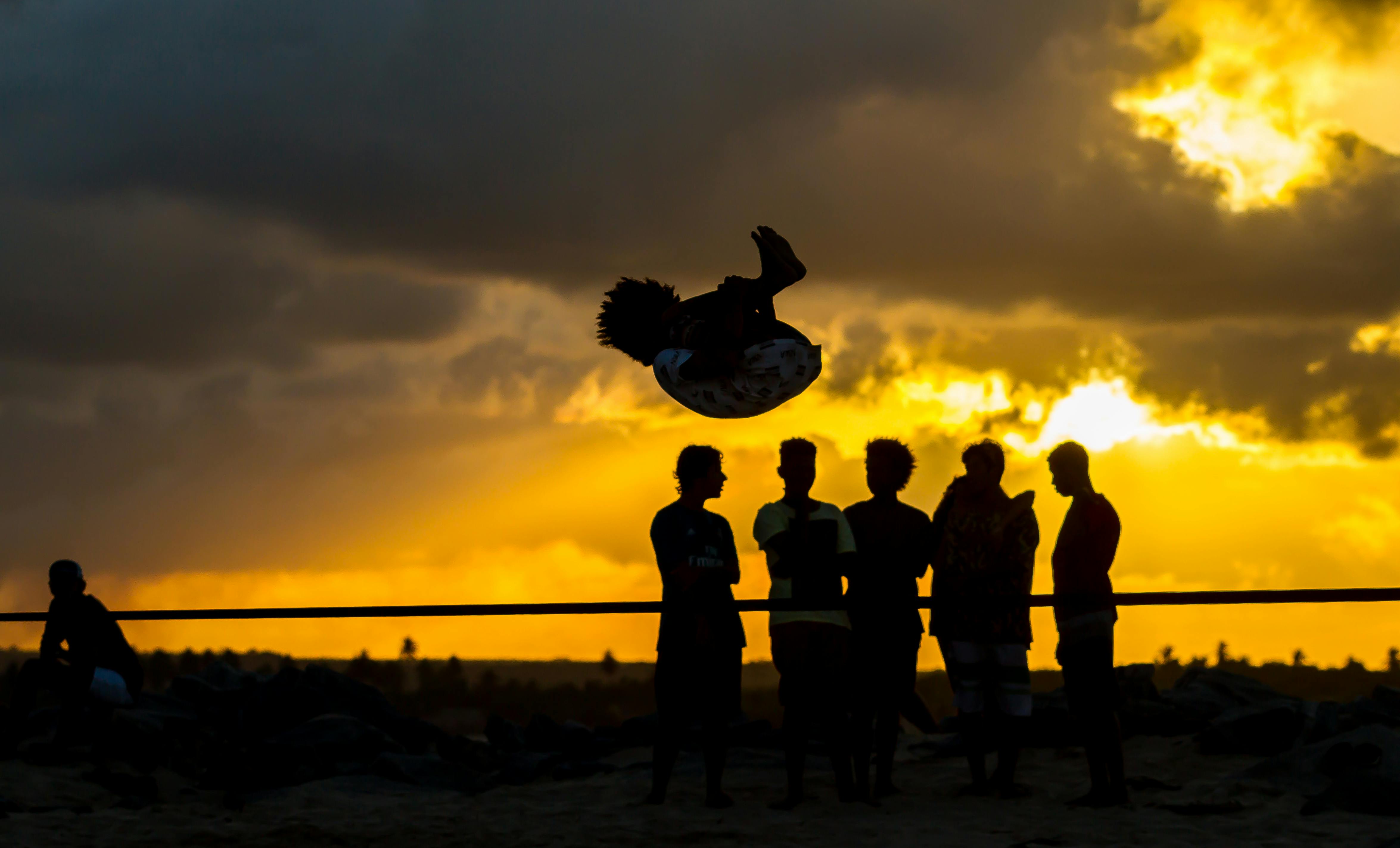 Audience at a concert in a large indoor arena with stage lights