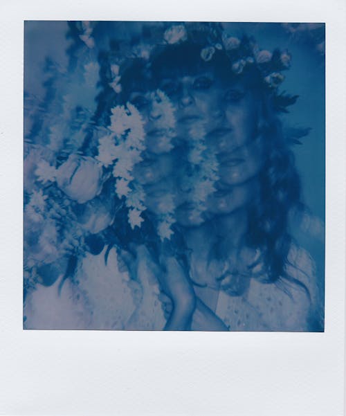 Blue Polaroid Photo of Woman Multiplied and Superimposed 