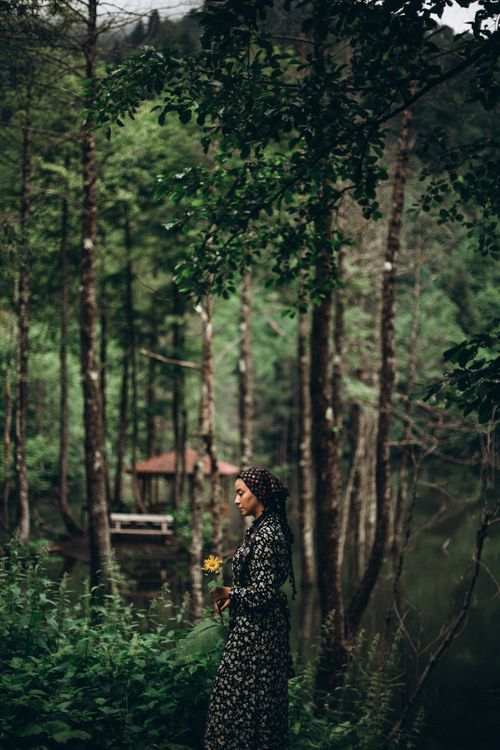 Free A serene moment captured of a woman in a wooded area in Türkiye during summer. Stock Photo