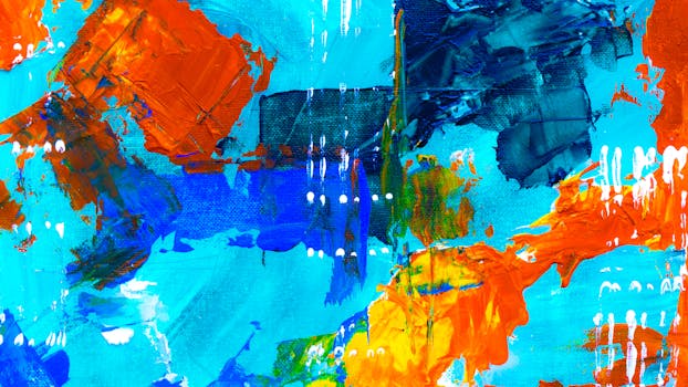 画布上有一幅色彩鲜艳的抽象画，以蓝色和橙色为主调