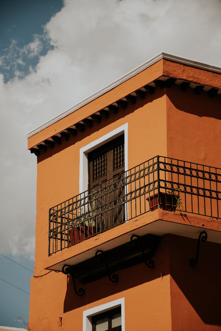 Sunlit Building With Balcony