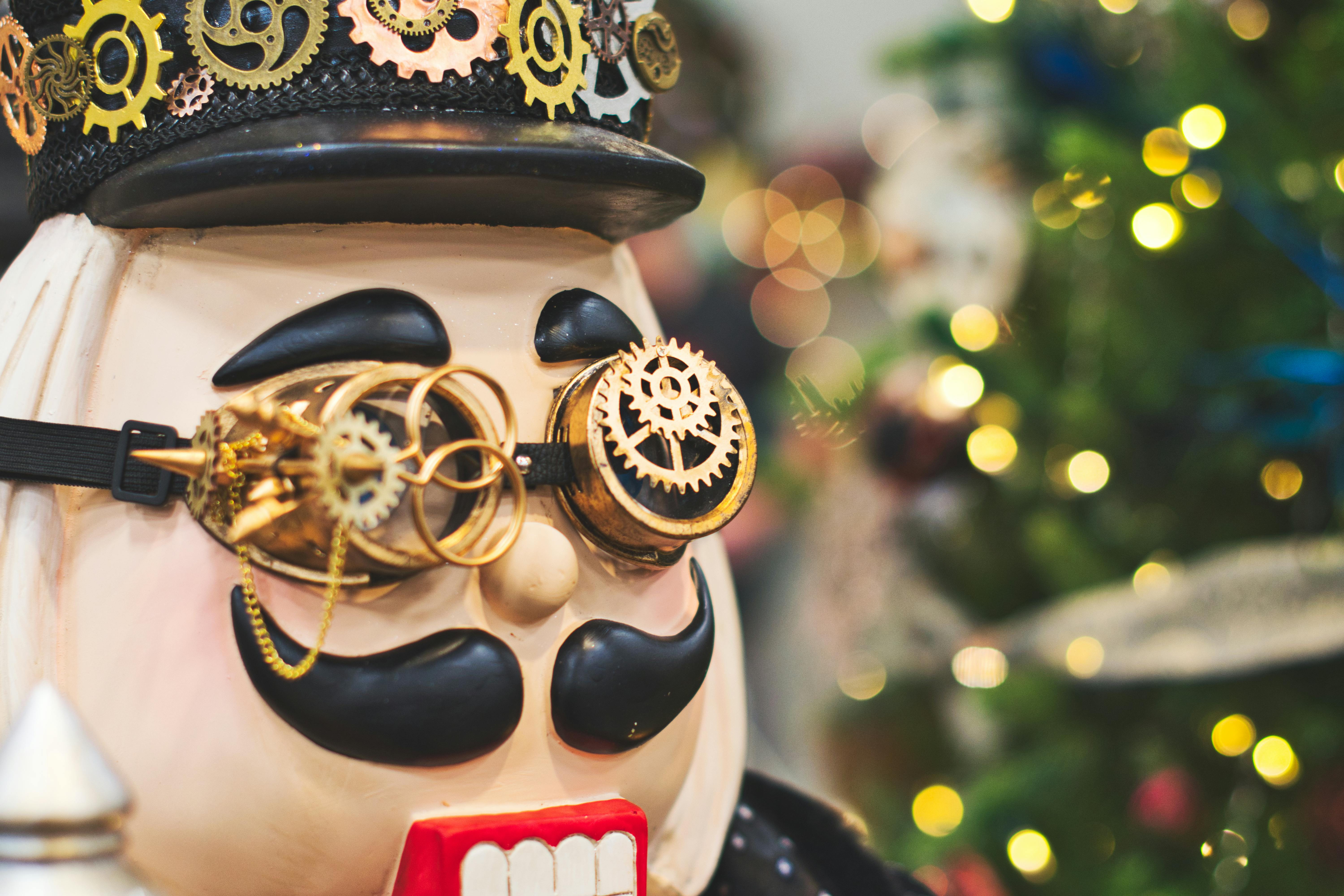 white and black cartoon character wearing gear sunglasses and hat figurine